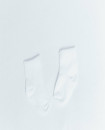 NEWBORN baby gift Set of Four White Sleeveless Onesie Pair of Gloves Pair of Socks Cotton Beanie